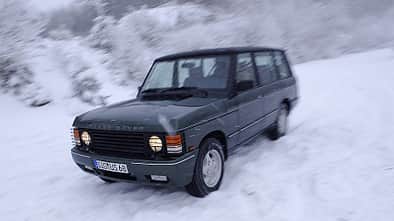 Austin Sprite und Range Rover Vogue