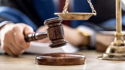 Symbols of law a legal system - a judge, gavel and scales representing jurisdiction.