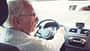 Old gentleman drives car