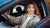 Pretty,Woman,Driver,Smiling,To,You,From,The,Car.,Automobile