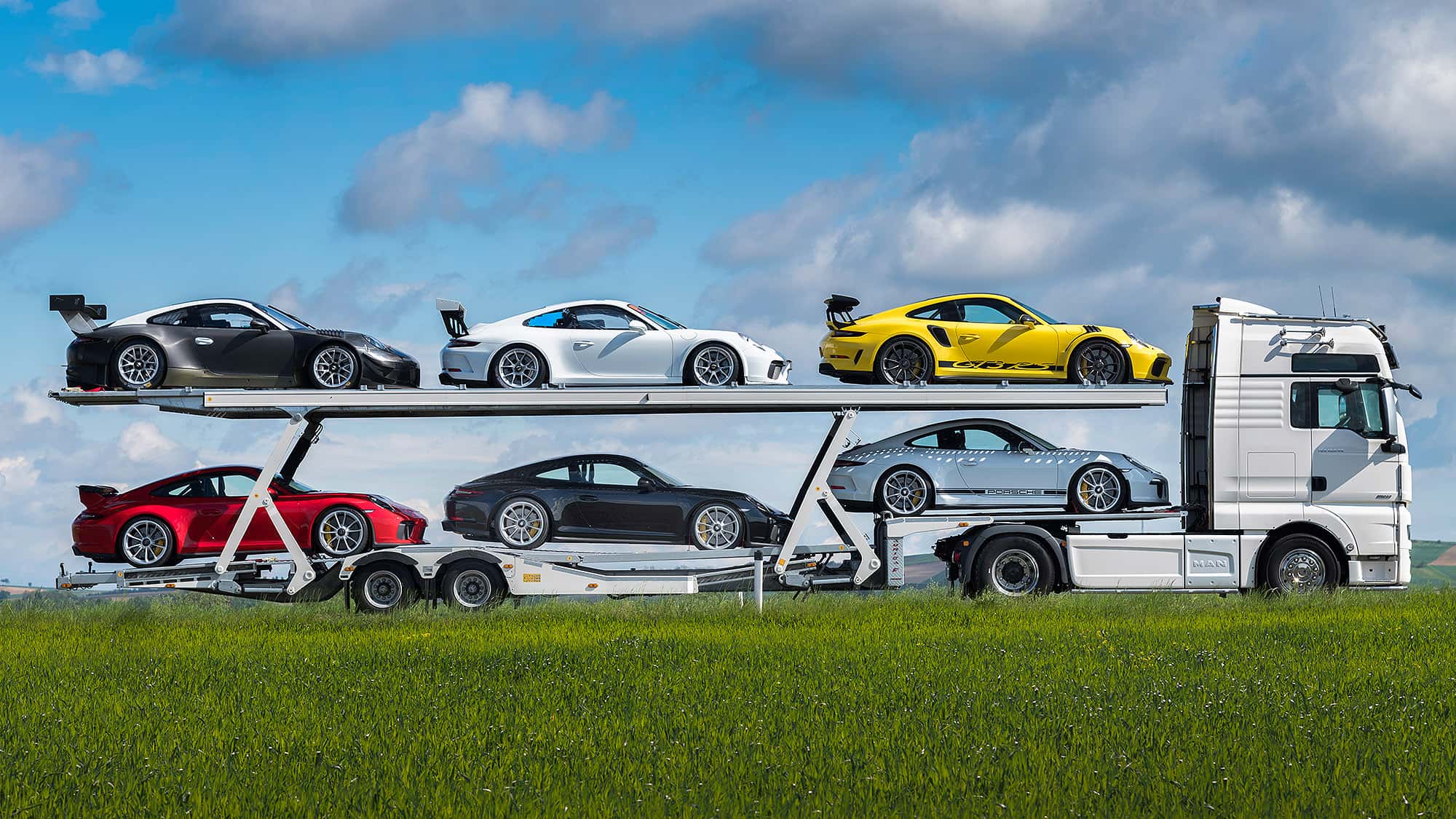 Man TGX 18.640 4×2 Autotransporter mit 6 Porsche 911 991